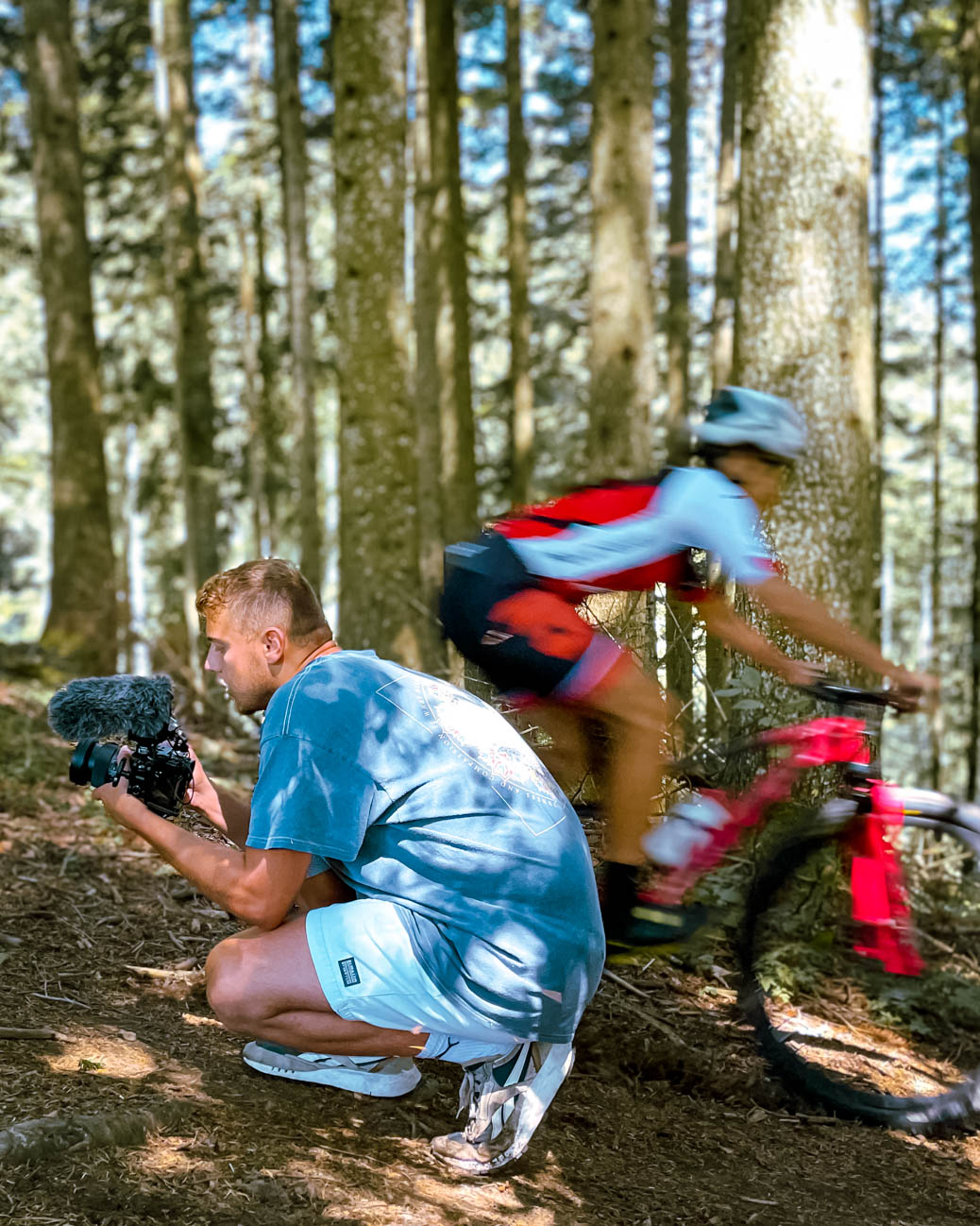 Mountain biker riding close to a cameraman